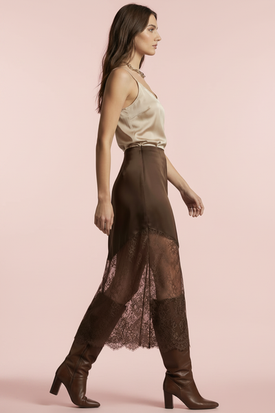 Side view of chocolate brown satin lace hem midi skirt on blush pink background
